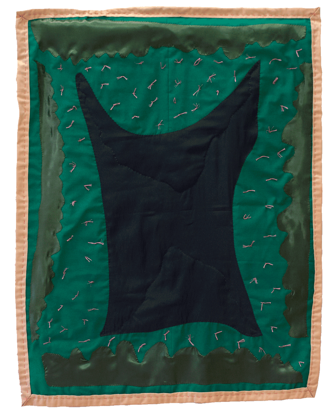 A large green quilt has a dark purple organic shape at the center, around it, 
                are four green fluid shapes. The quilt has a peach colored binding and hot pink knots
                scattered throughout the surface.