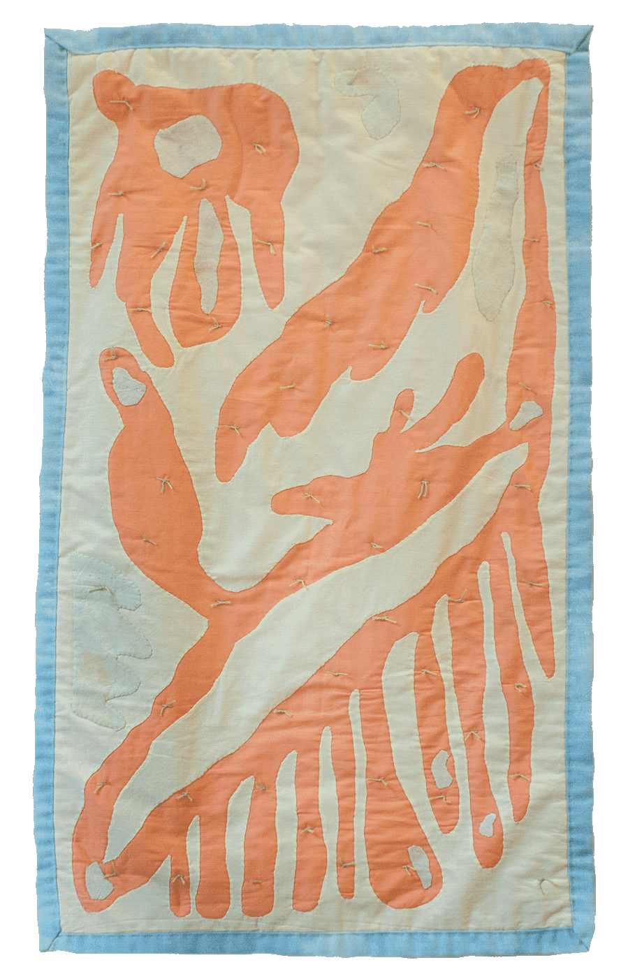 A pale yellow quilt has salmon pink organic shapes throughout the surface and 
                there are light green knots within the salmon pink shapes. The quilt has a light blue
                binding.