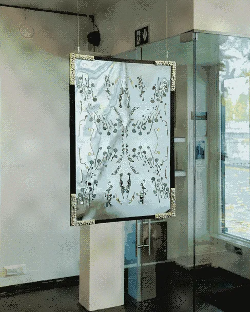 The same gallery space, but from a different angle hangs a reflective mix media artwork
